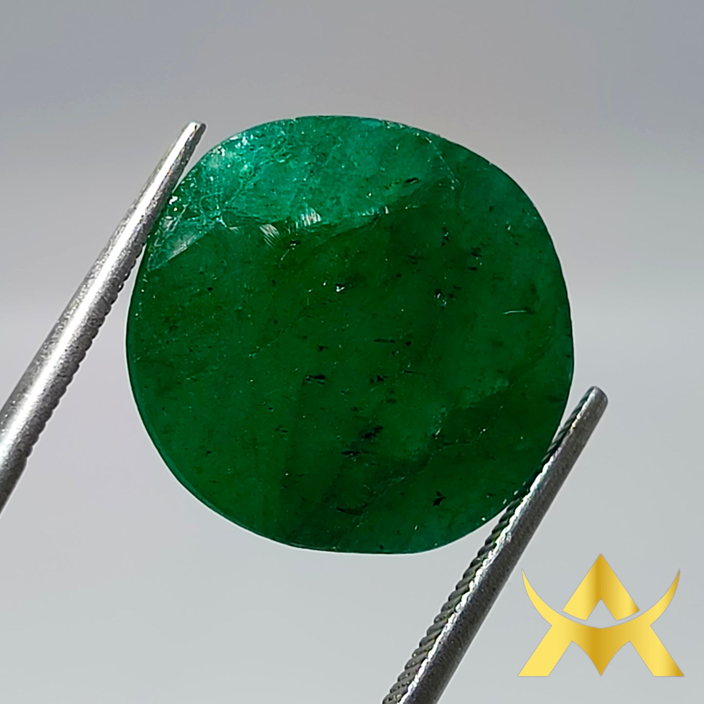 Brazil Emerald 14.01 ct. Not enhanced with Opaque Clarity and Very Good Cut Grade