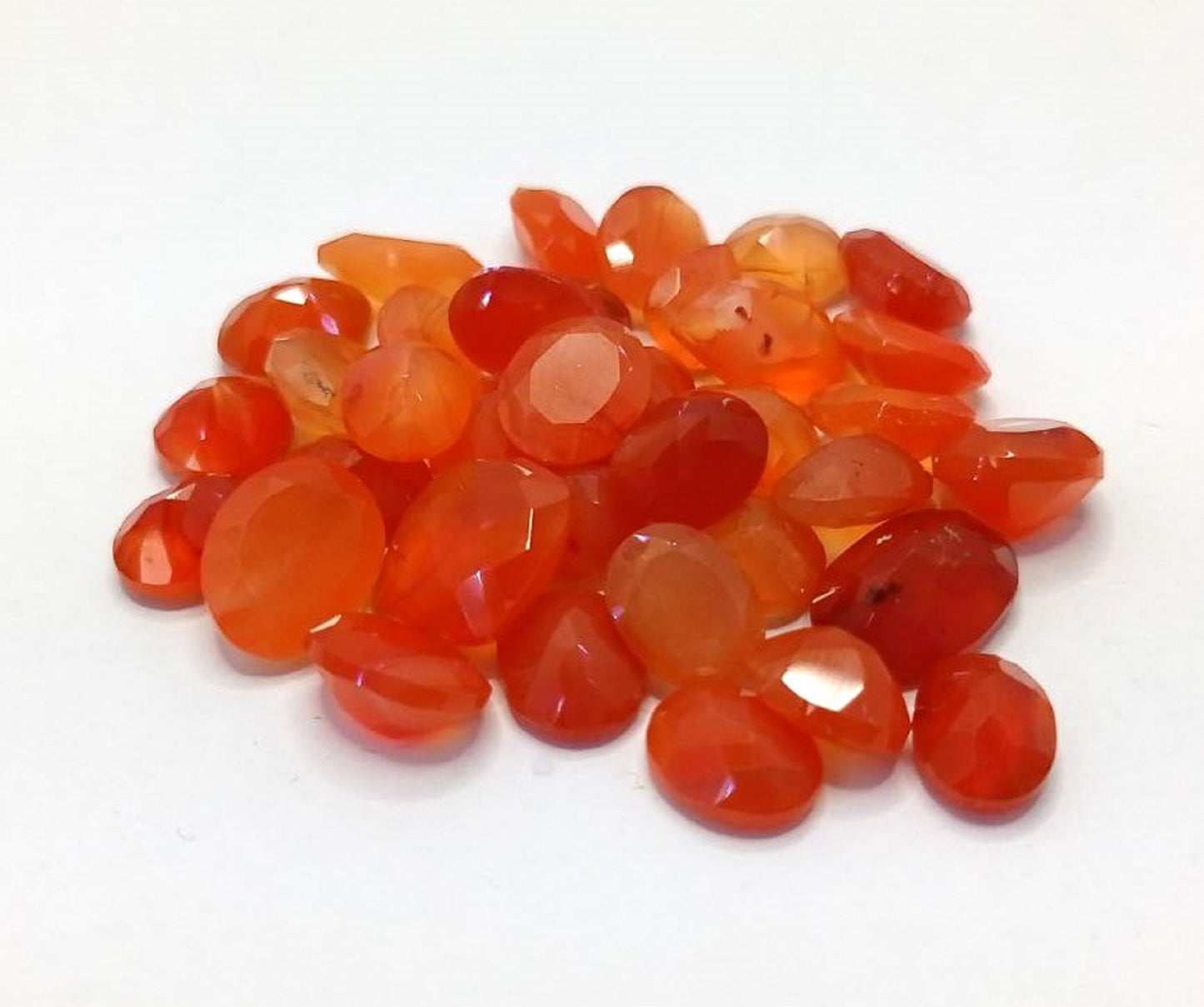 Carnelian 103.10 ct. Lot not enhanced with very Good Cut Grade and SI - Translucent Transparency